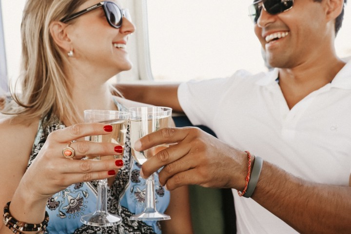 a woman drinking from a glass