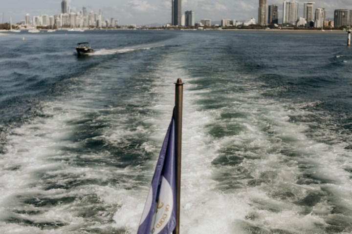 a body of water with a city in the background