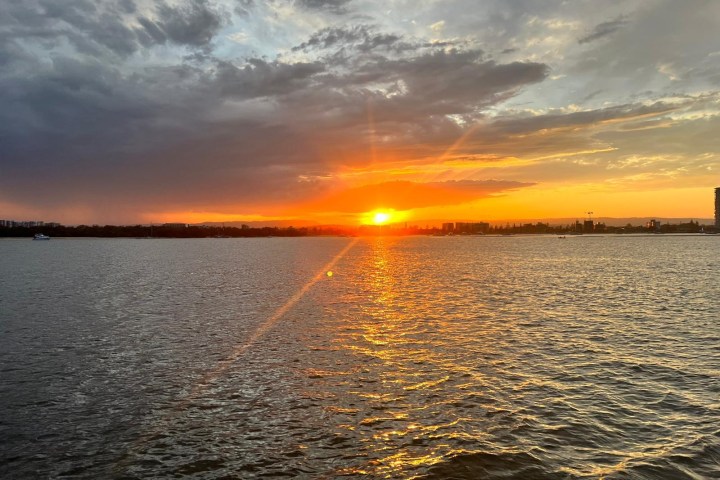 a sunset over a body of water