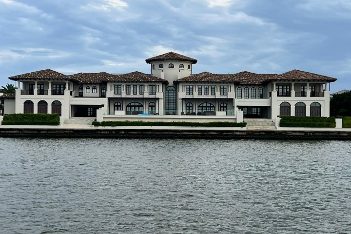 a building next to a body of water