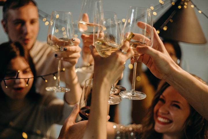 a man holding a glass of wine